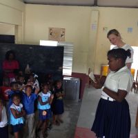 Grenada 2013. Following a book delivery to Samaritan Union School, Sonya White listens to a local poet. image