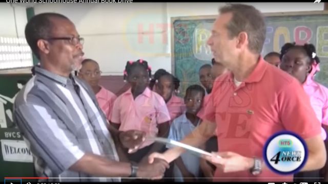 Local TV covered the event. Pius Bastien–Desruisseaux School principal–offers Richard the 