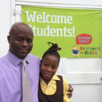 Wakeley Daniel, Permanent Secretary, Office of the Premier and his daughter attended the first Rainforest of Reading in Nevis. image