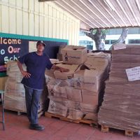 St. Lucia 2012. Clement, the school custodian, has the task of distributing boxes of books at Soufrière Primary image