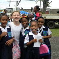 Student Ambassador Marlaina White (centre). 2015 was Marlaina's third time seeing girls from Reunion Primary. image